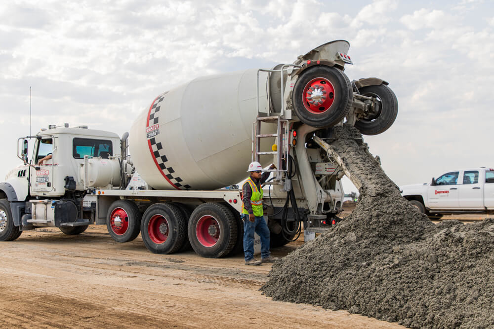 Constructors pouring cement at Crete Carrier Headquarters